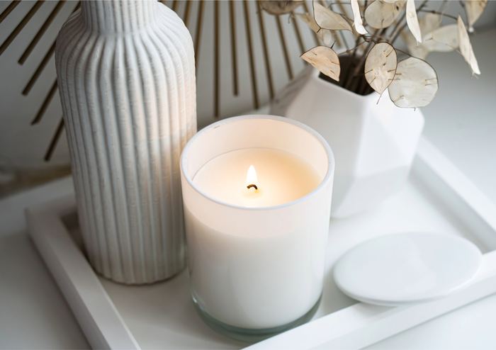 Console table styled with candles, vases and pampas grass